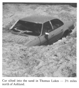 Car silted into the sand in Thomas Lakes