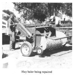 Hay baler being repaired